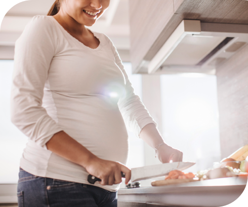 Pregnant woman chopping food