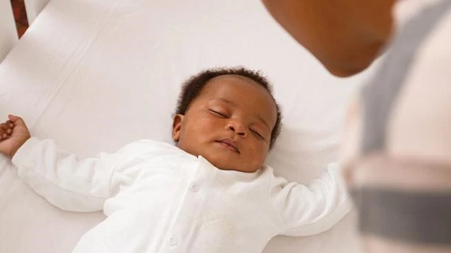 Baby sleeping in a crib