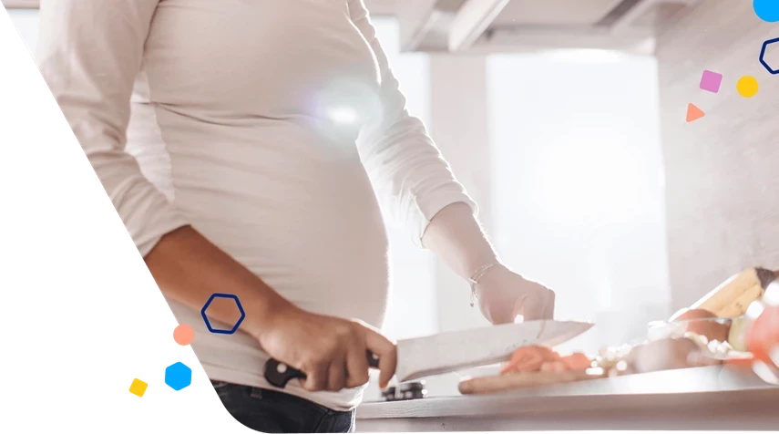 Pregnant woman chopping food