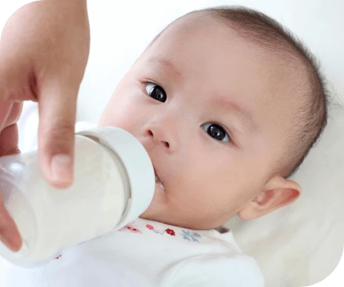 Baby being fed a bottle