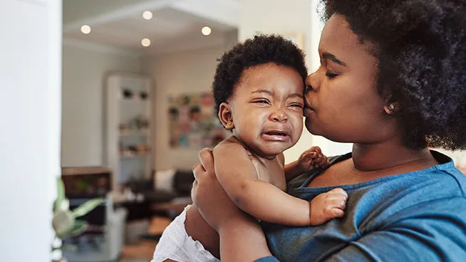 Mom comforting her fussy baby