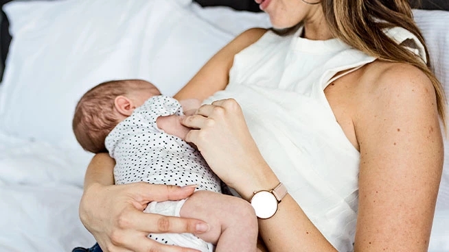 Mom breastfeeding preemie baby