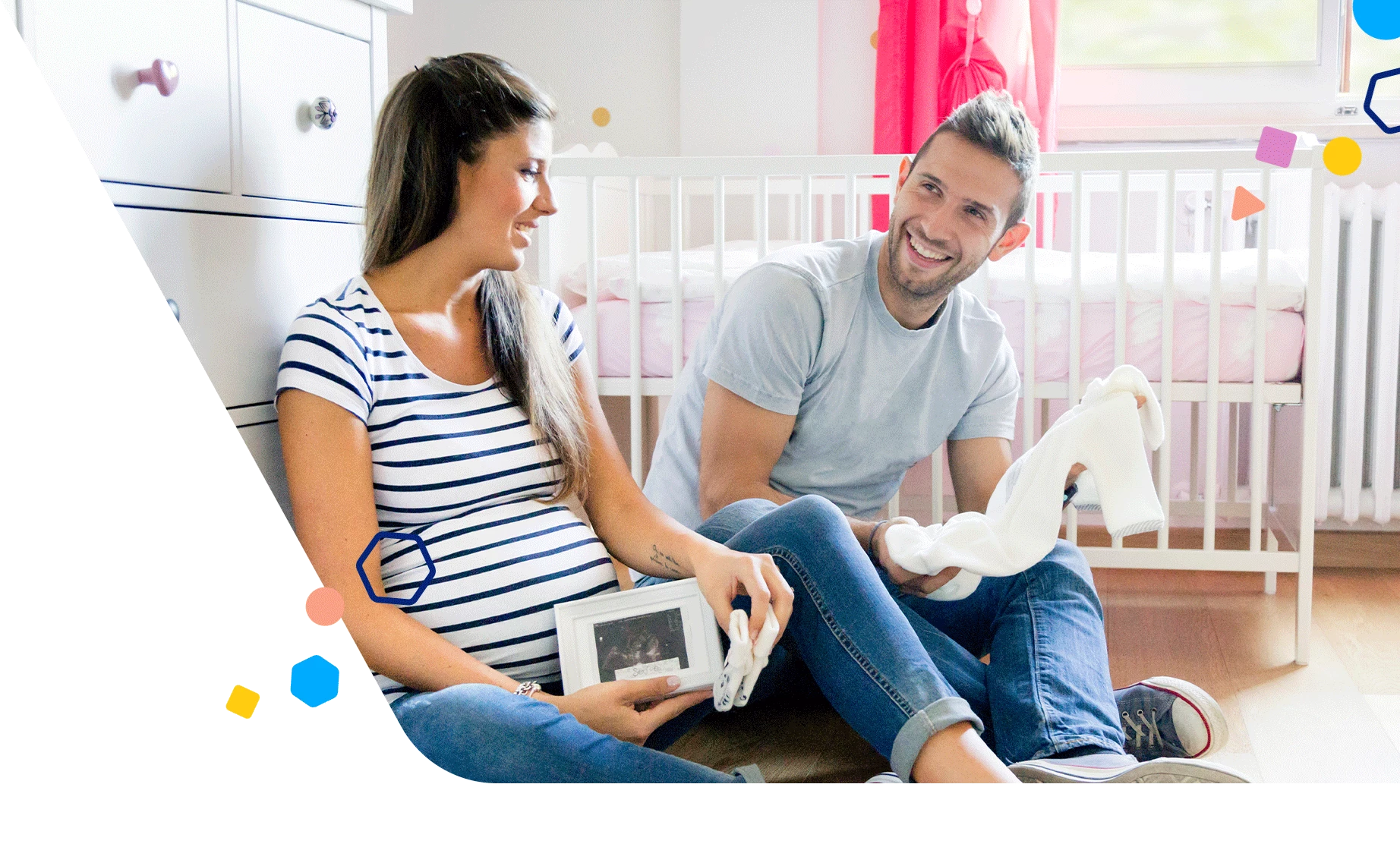 Expecting couple talking in baby's nursery