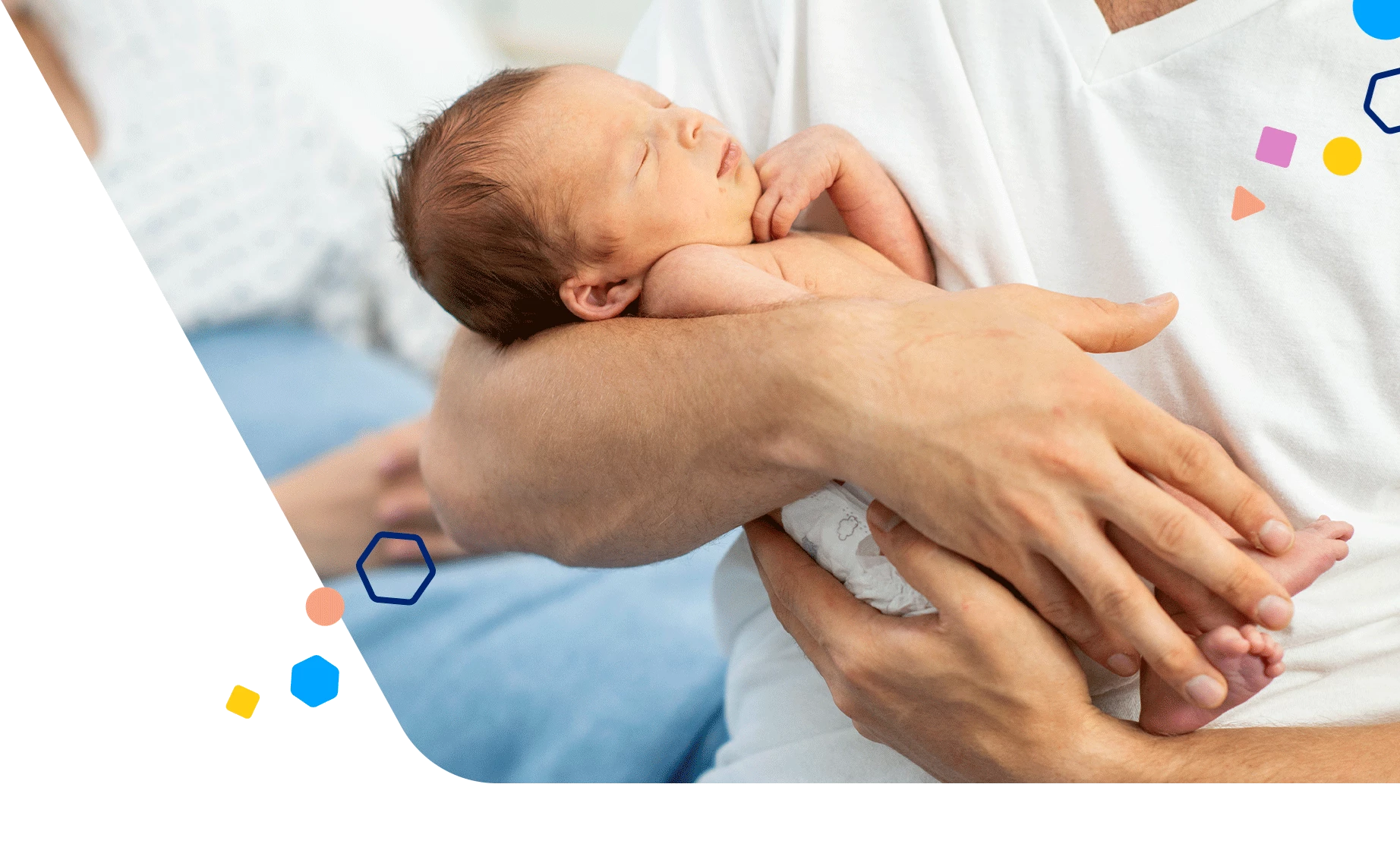 Dad holding premature baby at the hospital