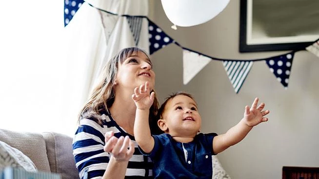 12 month milestone: Toddler son and mom and toddlers first birthday party