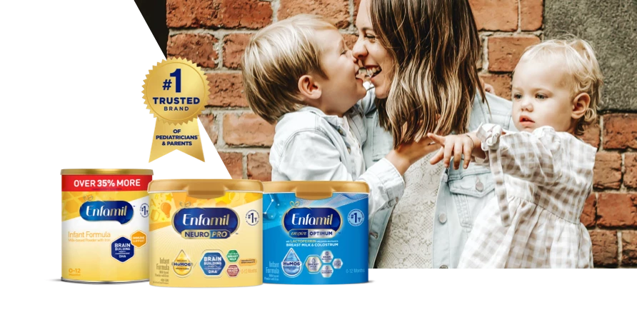 Happy mom with two children with Enfamil product lineup that is #1 Trusted Brand of Pediatricians* and Parents