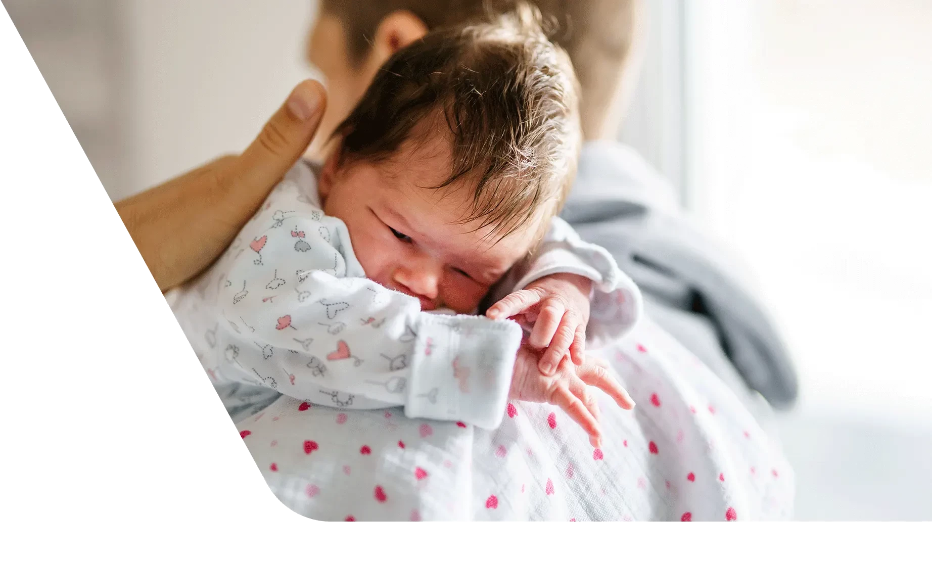 Dad comforting newborn