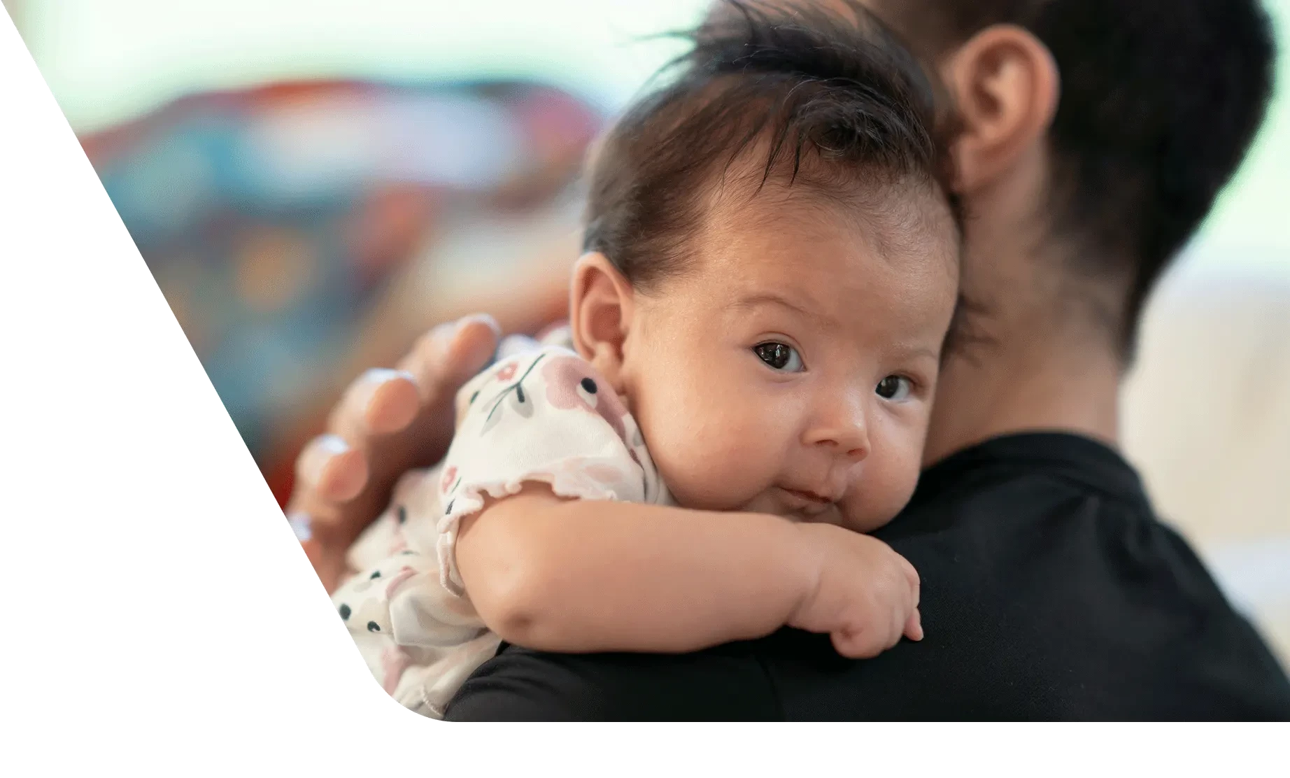 Dad holding newborn baby