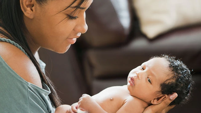 New mom holding newborn