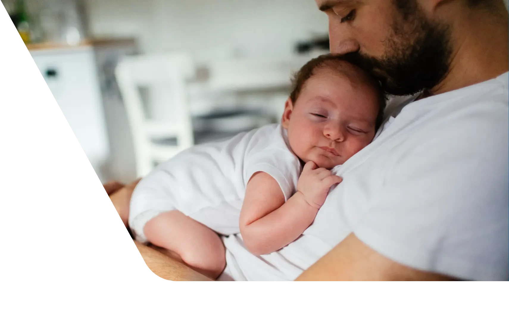 Baby sleeping on dad's chest