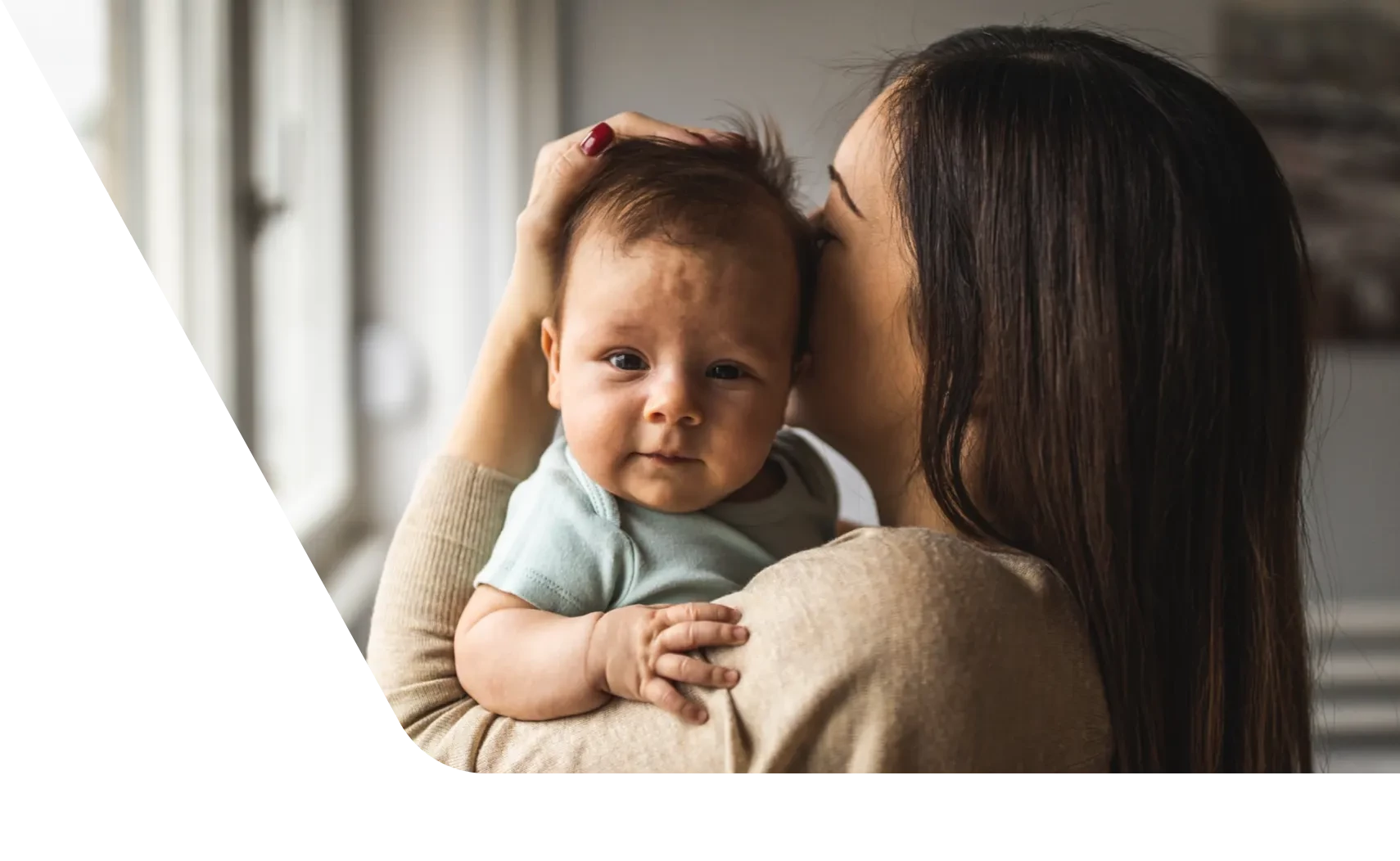 Mom holding baby against her chest