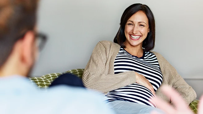 Couple smiling while discussing baby names