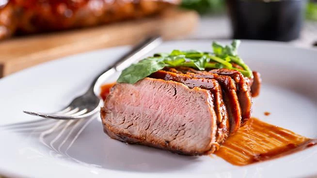 Tuscan pork with chickpeas and spinach on a plate