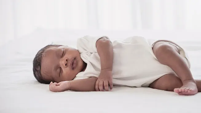 Newborn sleeping on their side