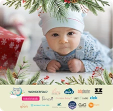 Baby lying on the floor framed by garland