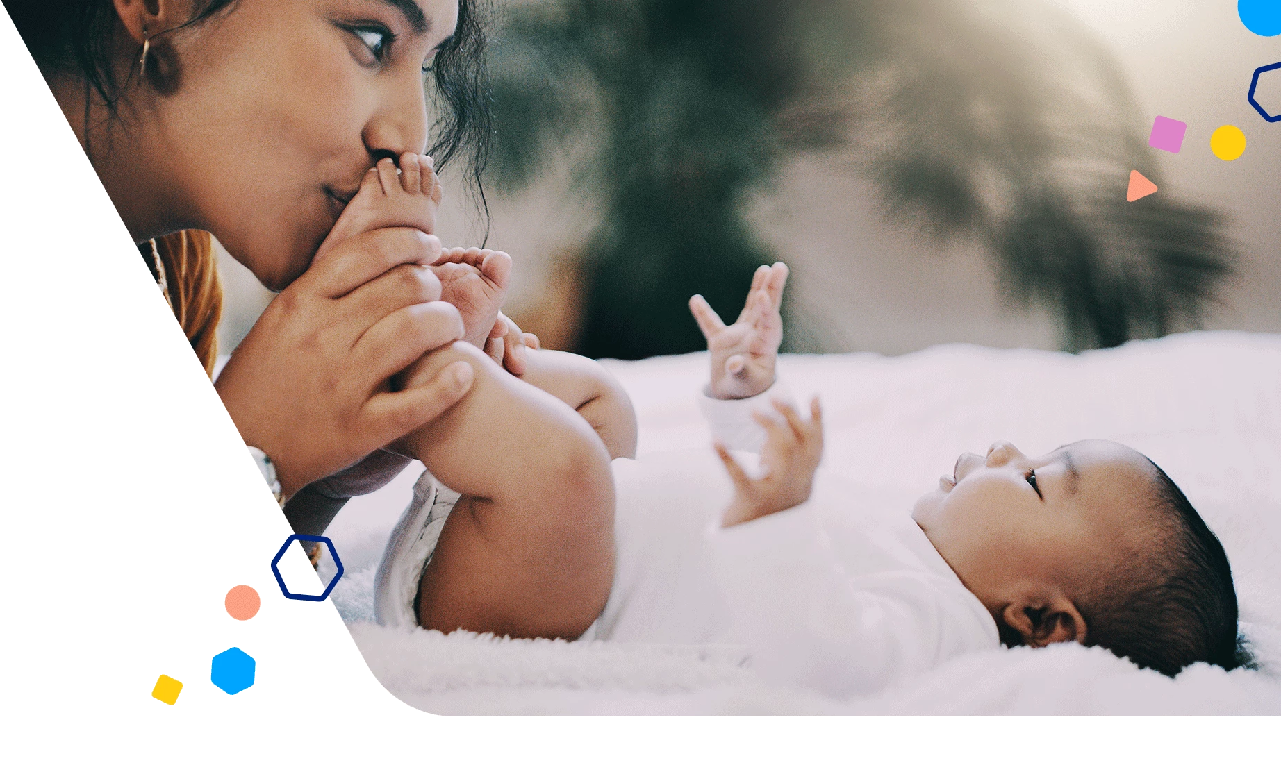 Mom kissing 3 month old baby's feet