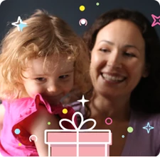 Mom holding smiling daughter