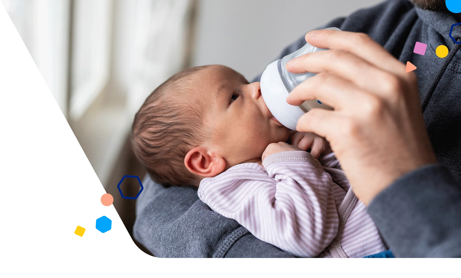 Dad bottle-feeding premature baby