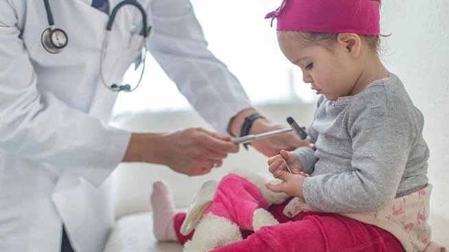 Toddler getting a checkup at pediatrician appointment