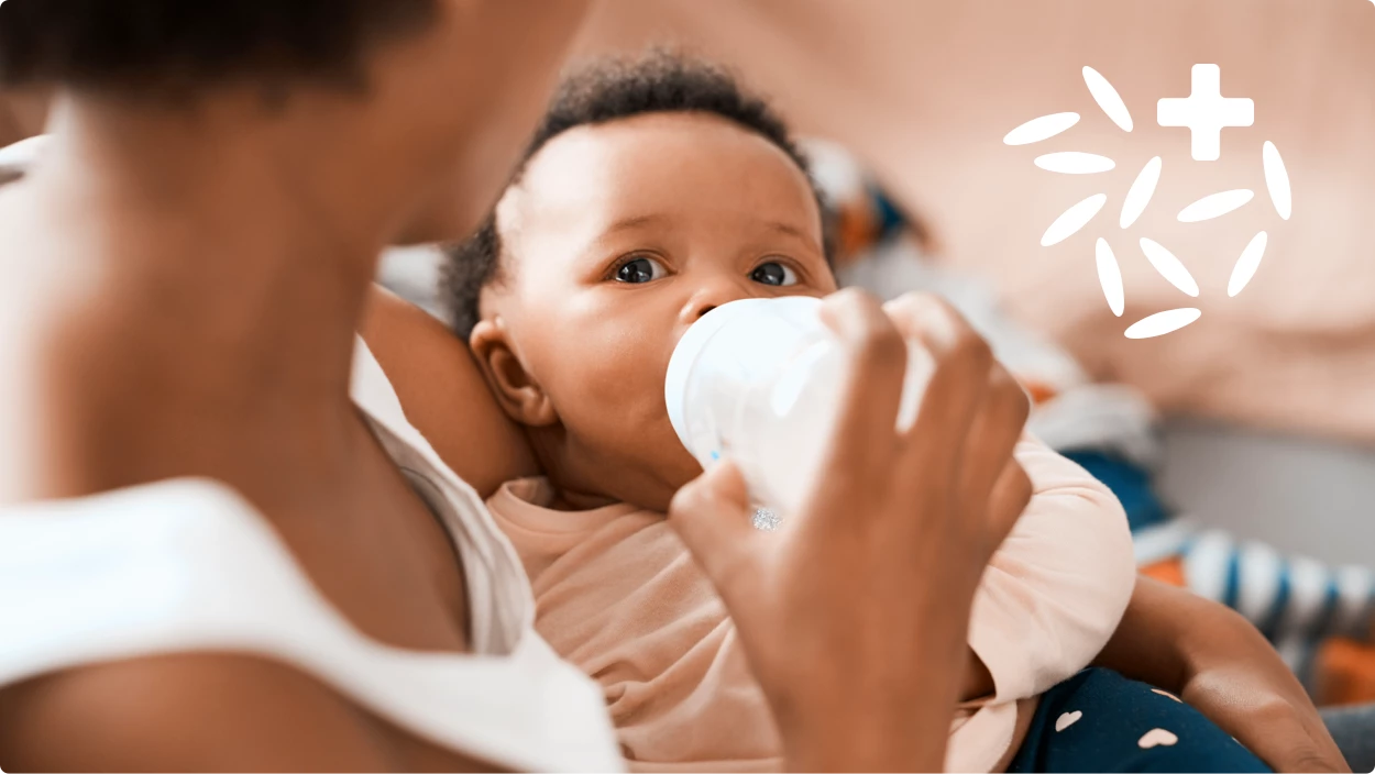 Baby being fed a bottle