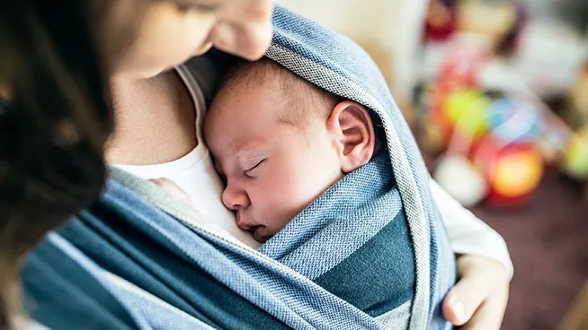 Mom holding 1 month old baby